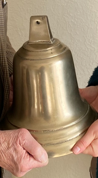 A large shiny brass bell